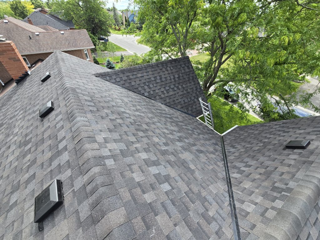 Residential roof replacement showing multiple roof planes, new shingles, roof vents, and valley transitions by 905 Roofing Inc. in Durham Region and the GTA