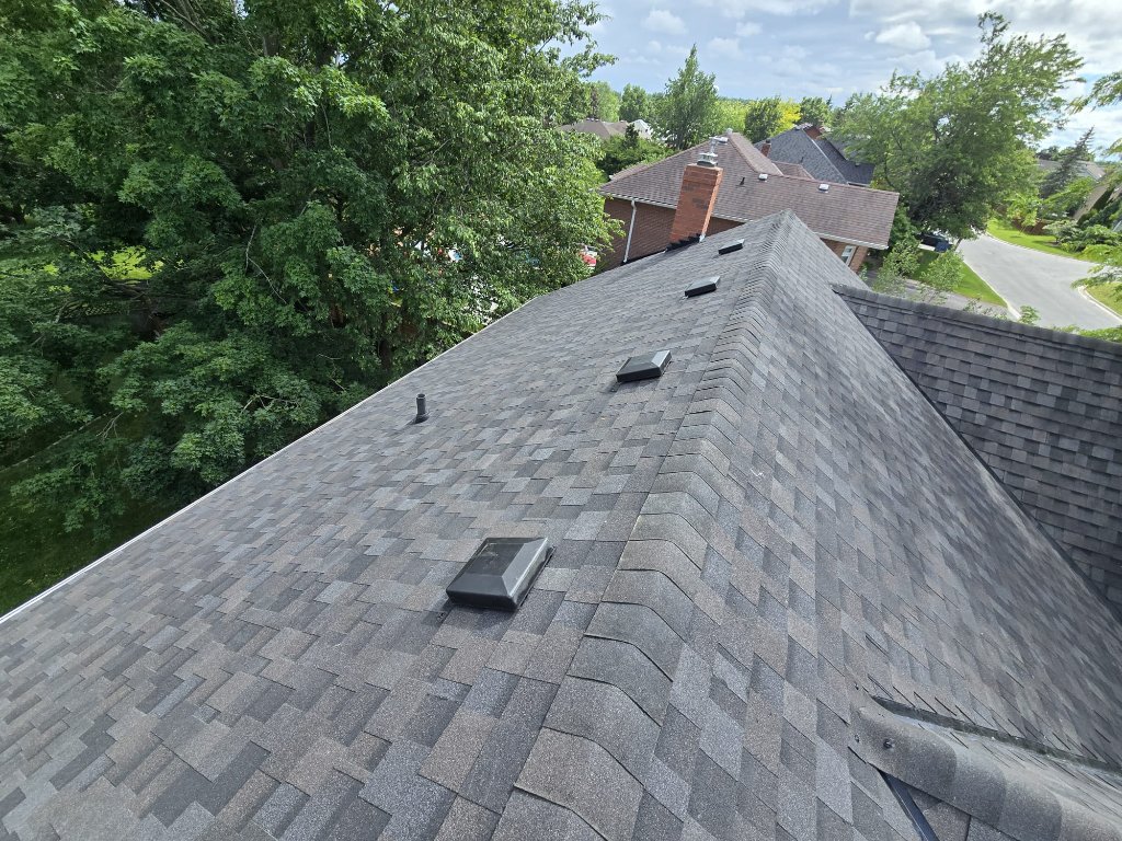 Finished asphalt shingle roof with ridge cap, roof vents, and clean installation details by 905 Roofing Inc. in Durham Region and the GTA